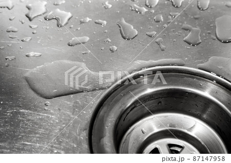 Water drops in the shiny stainless sink Water drops in the shiny stainless sink 87147958