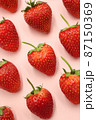 Top view of Beautiful red strawberry pattern on isolated pink background 87150369