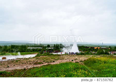 Strokkur geyser and tourist visitors in Haukadalur valley geothermal area in southwestern Iceland. Strokkur geyser and tourist visitors in Haukadalur valley geothermal area in southwestern Iceland. 87150762