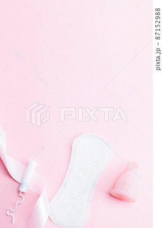 Menstrual cup, tampon, woman cup for sanitary protection. Pink ribbon with menstrual cup. Menstruation feminine period. Zero waste concept, ecofriendly lifestyle, reduced banner consumption. Menstrual cup, tampon, woman cup for sanitary protection. Pink ribbon with menstrual cup. Menstruation feminine period. Zero waste concept, ecofriendly lifestyle, reduced banner consumption. 87152988