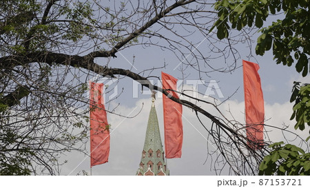 Red flags fluttering in the wind against the blue sky Red flags fluttering in the wind against the blue sky 87153721