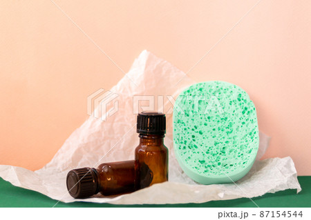 Aroma oil glass bottle with torn paper, skin care products Aroma oil glass bottle with torn paper, skin care products 87154544
