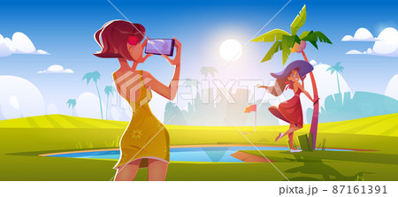 Girl take photo of woman on golf course 87161391