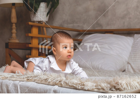 little baby girl standing on all fours. little baby girl standing on all fours. 87162652