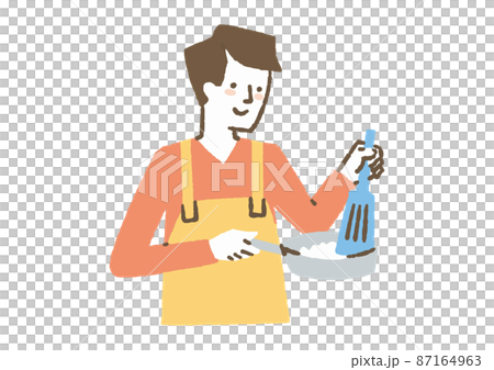 エプロンをして料理をする男性_色 87164963