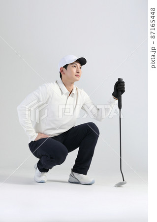 golf sports player, asian korean man with golf club in studio golf sports player, asian korean man with golf club in studio 87165448