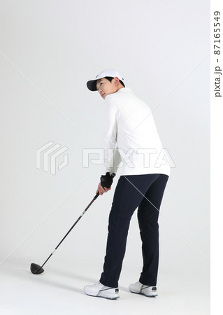 golf sports player, asian korean man with golf club in studio golf sports player, asian korean man with golf club in studio 87165549