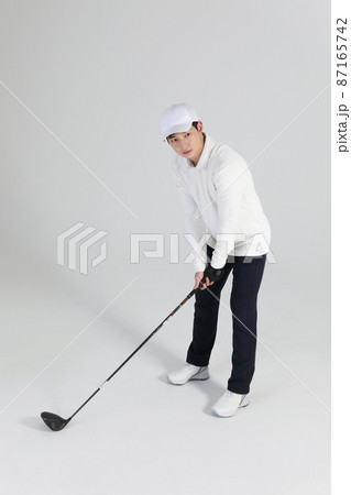 golf sports player, asian korean man with golf club in studio golf sports player, asian korean man with golf club in studio 87165742