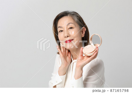 Asian Korean senior woman, bold and red cosmetics makeup beauty concept in studio 87165798