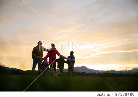 Family of five having fun outside at dusk Family of five having fun outside at dusk 87168480