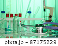 Stethoscope on Chemical Lab - Labs Photo in Green Colors 87175229