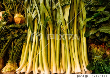 organic and fresh green leeks in the market  87176144