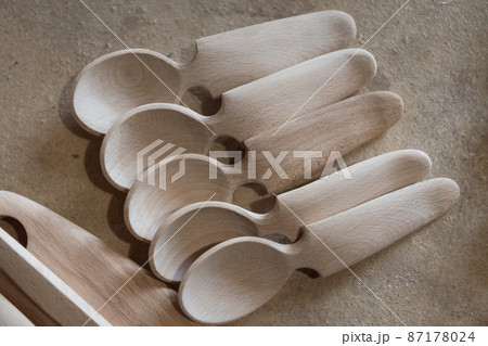 Handmade Wooden Spoons for hiking and outdoor activities. Craftsmanship and artisan concept Handmade Wooden Spoons for hiking and outdoor activities. Craftsmanship and artisan concept 87178024