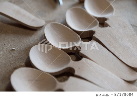 Handmade Wooden Spoons for hiking and outdoor activities. Craftsmanship and artisan concept Handmade Wooden Spoons for hiking and outdoor activities. Craftsmanship and artisan concept 87178084