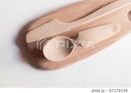 Handmade Wooden Spoons for hiking and outdoor activities. Craftsmanship and artisan concept Handmade Wooden Spoons for hiking and outdoor activities. Craftsmanship and artisan concept 87178136