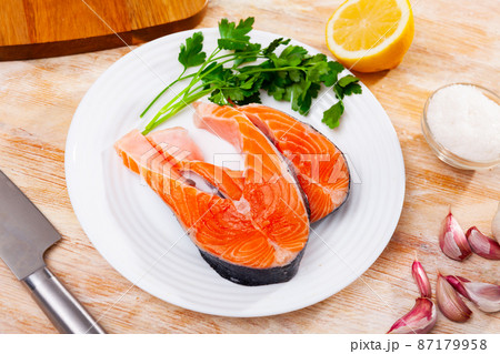 Fresh sliced steaks of salmon 87179958