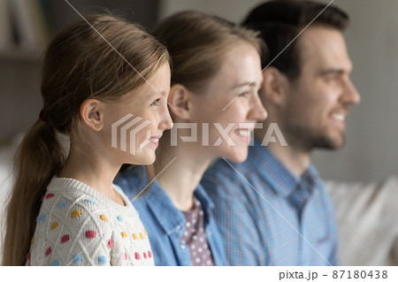 Happy pretty girl kid home portrait with mom and dad 87180438