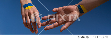 females hands painted in Ukraine flag colors females hands painted in Ukraine flag colors 87180526