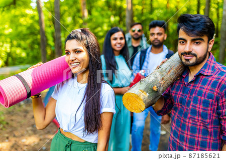 Multiracial pakistanian happy friends at picnic camping park Multiracial pakistanian happy friends at picnic camping park 87185621