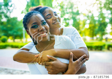 happy african american one gender couple in love dating outdoors in summer park 87185796