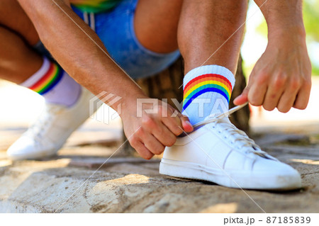 close up of rainbow white socks and choes outdoors 87185839