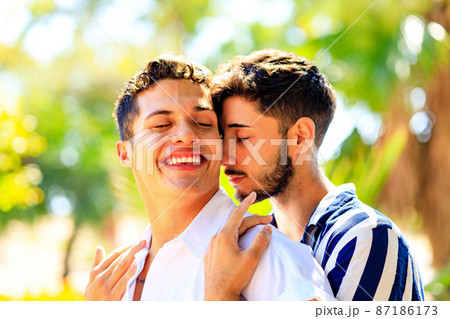 young same sex couple in love outdoors together showing all of feels 87186173