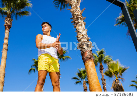 young modern ballet dancer looking away with tired look in summer beach sunny 87186693