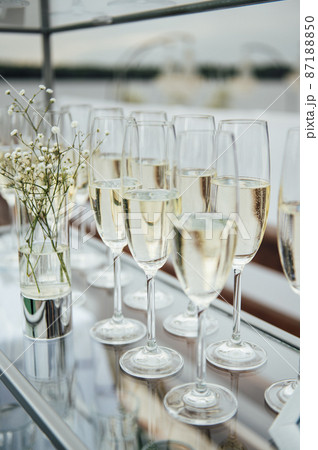 Glasses of champagne at the Banquet, white sparkling wine in wine glasses, festive mood 87188850