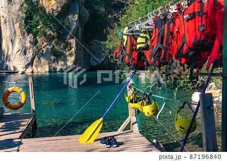 Pier for rafting with folded equipment - life jackets, helmets, oars. Goynuk canyon, Antalya Pier for rafting with folded equipment - life jackets, helmets, oars. Goynuk canyon, Antalya 87196840