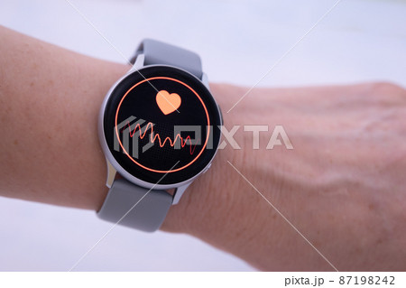 Heart rate check with smart watch. Close-up 87198242