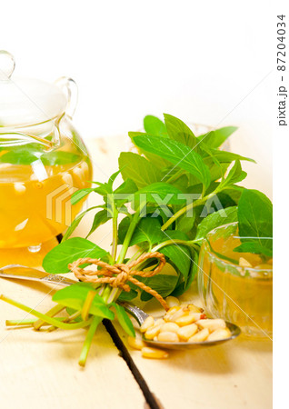 Arab traditional mint and pine nuts tea Arab traditional mint and pine nuts tea 87204034