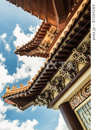 Gable roof architecture against a blue sky background of Taiwanese temple-style at Fo Guang San Temple. 87204264