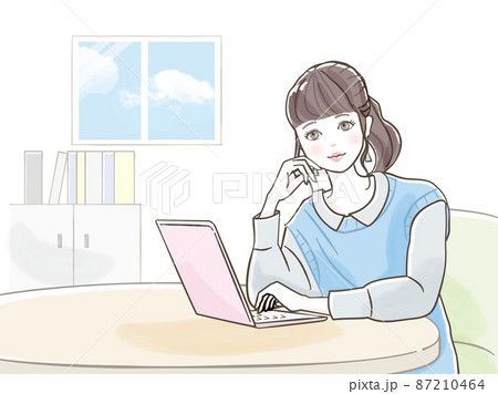 パソコンで仕事をしている若い女性 87210464