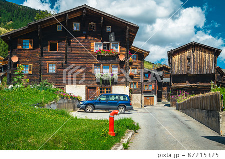 Orderly street with traditional old wooden houses in Switzerland Orderly street with traditional old wooden houses in Switzerland 87215325