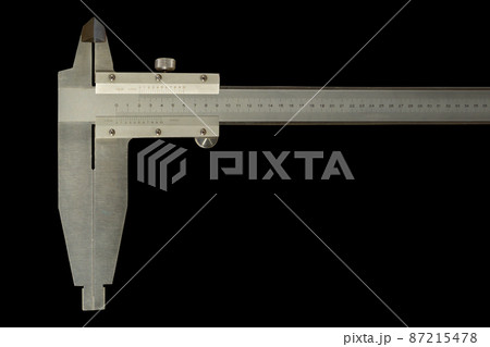 Analogue vernier calliper made of stainless steel for precise measurements, isolated on black background 87215478
