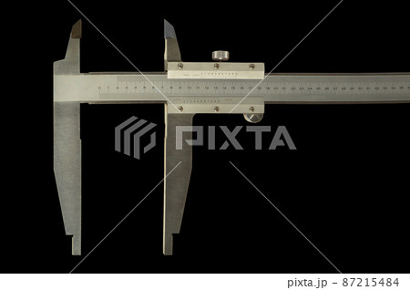 Analogue vernier calliper made of stainless steel for precise measurements, isolated on black background 87215484