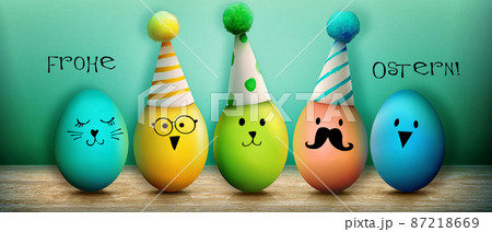 Easter background with colorful easter eggs on wooden background. 87218669