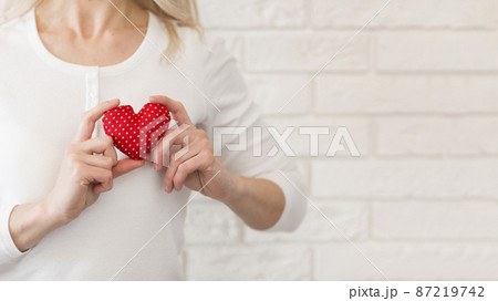 close up woman with little heart 87219742