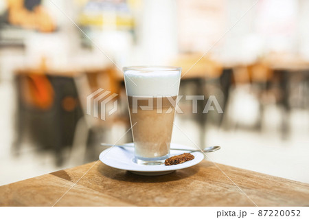 cappuccino coffee glass with spoon wooden table 87220052