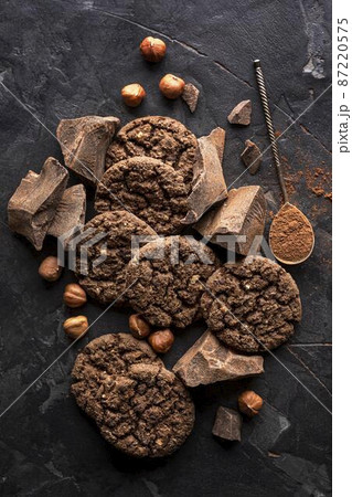 top view chocolate cookies with hazelnuts cocoa powder 87220575