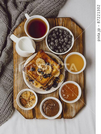 top view breakfast toast with blueberries banana 87221302