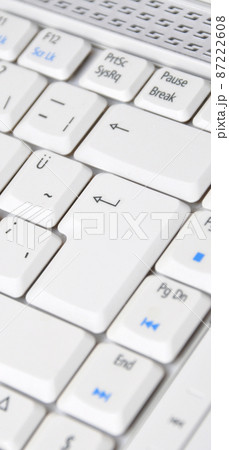 A white color laptop and Q keyboard detail A white color laptop and Q keyboard detail 87222608