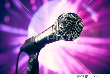 microphone against purple disco background 87222677