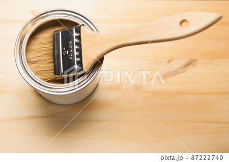 brown paint can and brush 87222749