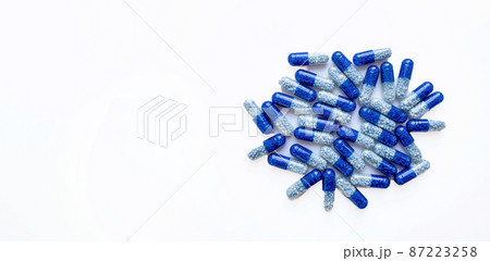 Selective focus, group of blue medical pills isolated on white background.Health and medicine concept 87223258