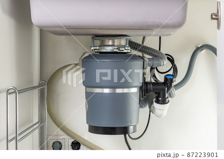 Garbage Disposal under the modern sink, waste chopper concept Garbage Disposal under the modern sink, waste chopper concept 87223901