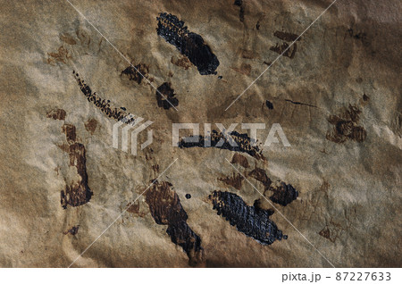 abstract background - burnt parchment paper 87227633