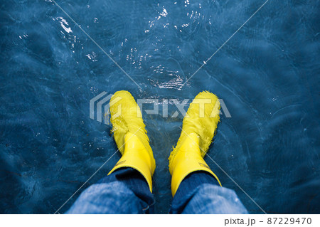 rubber boots in the water 87229470