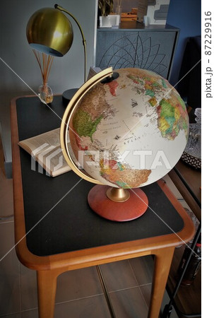 Researching with a desk globe 87229916