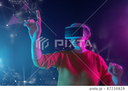 Woman with VR virtual reality goggles Woman with VR virtual reality goggles 87230829